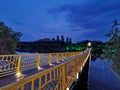 The reflection of the pontoon and pontoon in the water at night forms a beautiful pictureÃ¯Â¼Ë3Ã¯Â¼â°.